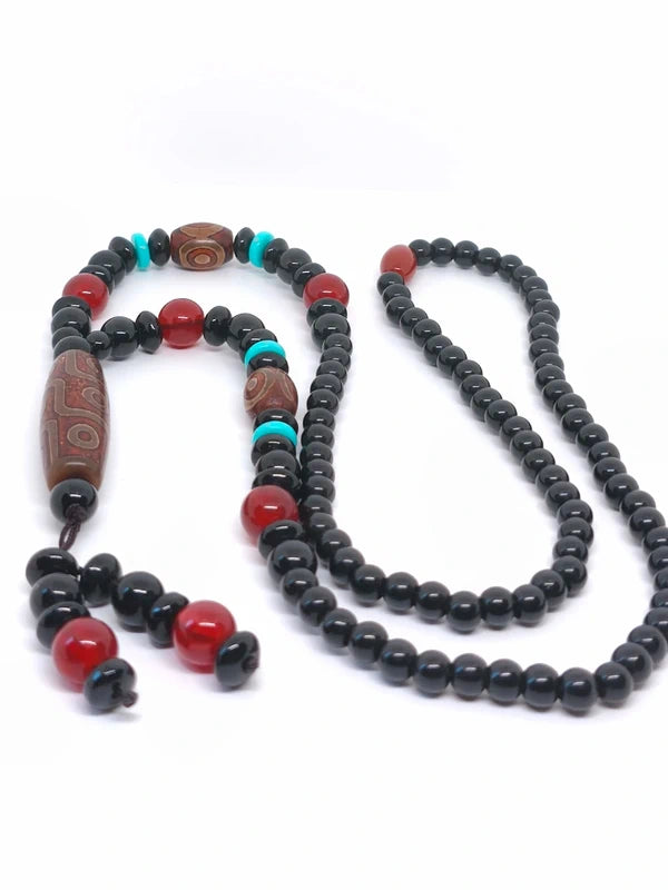 Collier ethnique en perles d'agate noire et bois de santal