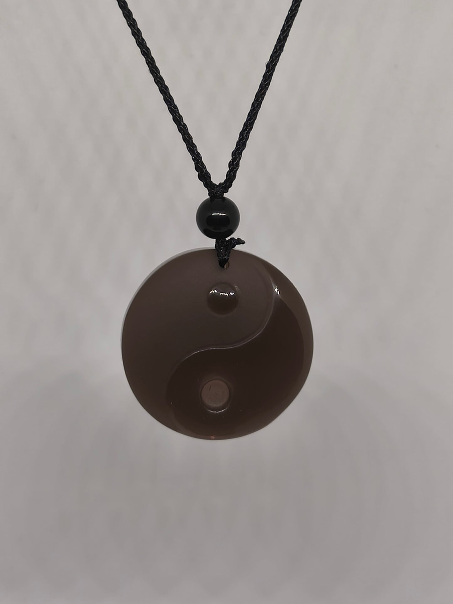 Collier yin yang en obsidienne glacée